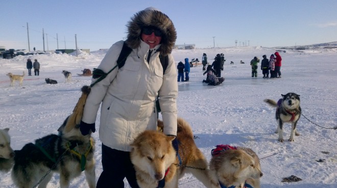 Offering encouragement to the sled dogs before the race